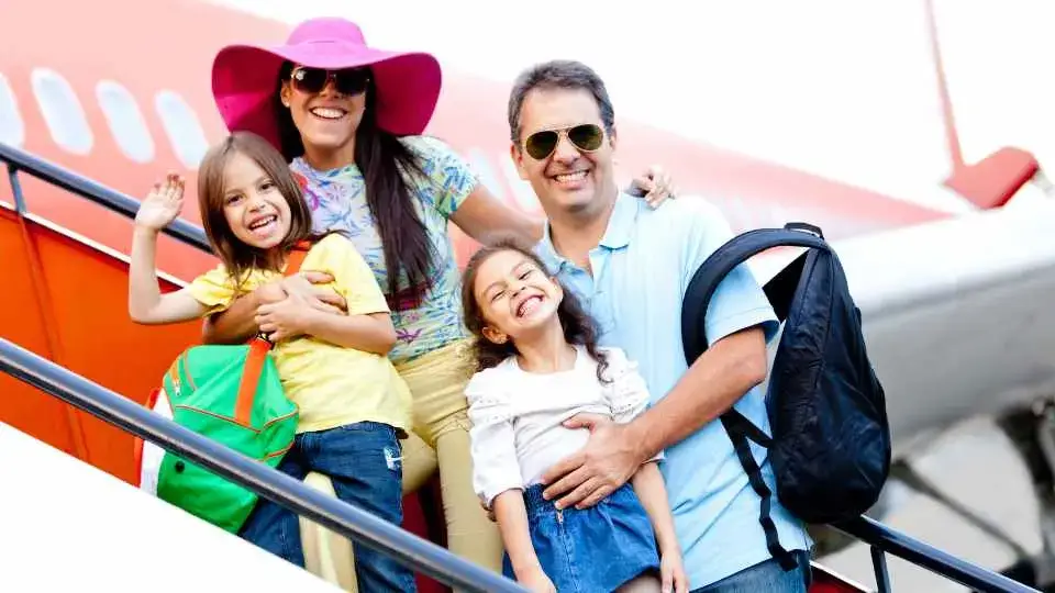 Family ready to board an airplane heading on holdiay